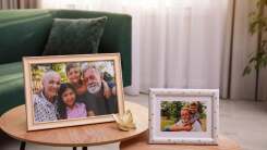 Framed family portraits in living room