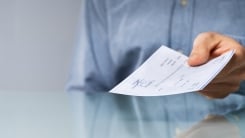 Person handing over check