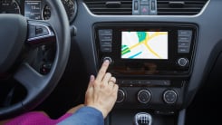 Woman using GPS in car
