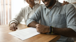 Couple signing agreement