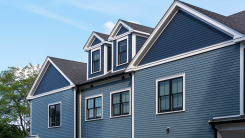 A blue duplex house facade in Boston, Massachusetts.