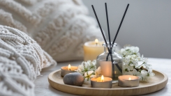 candles and diffuser in bedroom