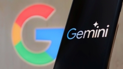 A phone displays the Gemini logo with the Google logo in the background