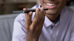 A man dictates to an iPhone