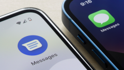 A phone displaying the Google Messages logo next to an iMessage logo
