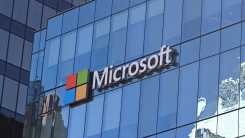 Microsoft logo on the exterior of a glass building