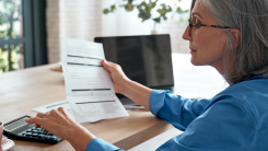 Woman using calculator