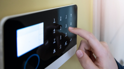 person's hand on control pad