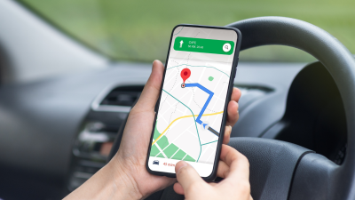 A person uses Google Maps in their car.