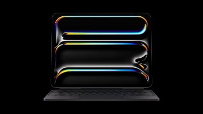 A photo of the M4 iPad Pro with a Magic Keyboard attached, against a black background.