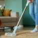 woman vacuuming a living room 