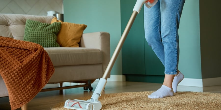 woman vacuuming a living room 